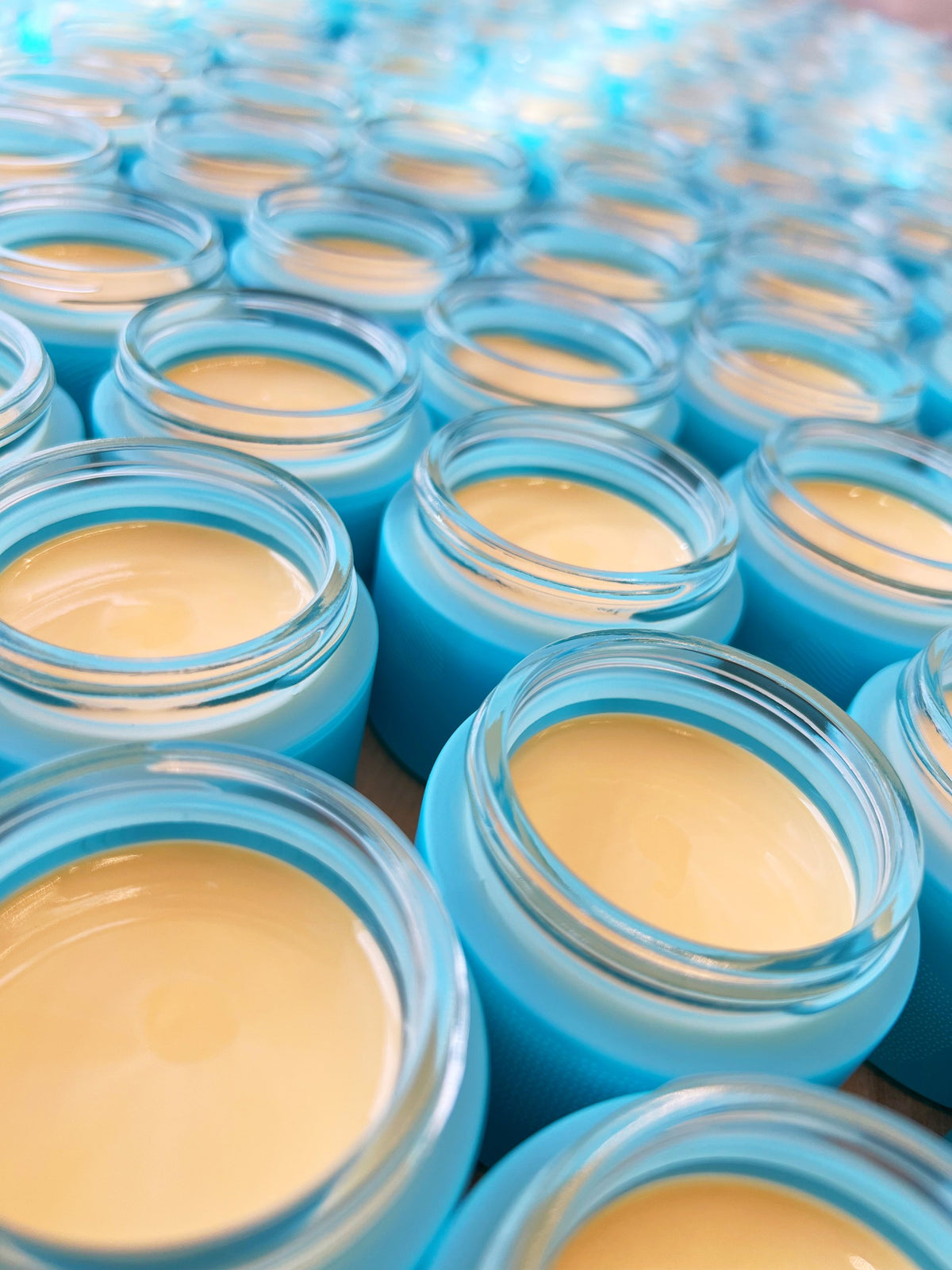 Open glass jars of No More Make-Up Skin Corrector, freshly dispensed